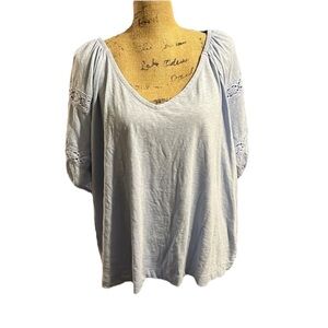 Lane Bryant light blue embroidered bell sleeve V-neck blouse.